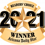 A gold star with the words readers choice 2021